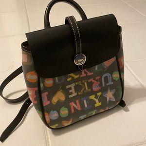 Black Dooney & Bourke mini back pack with multicolored letters.